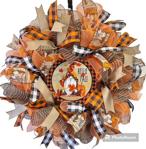A fall-themed wreath with orange, black, and white colors, featuring pumpkin images and text 'Hello Fall'.